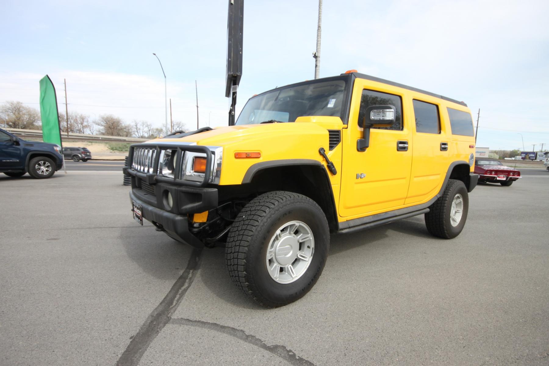 2003 Yellow /Gray Hummer H2 H2 (5GRGN23U73H) with an 6.0 Gasoline V8 engine, 4 speed automatic transmission, located at 4562 State Avenue, Billings, MT, 59101, (406) 896-9833, 45.769516, -108.526772 - 2003 Hummer H2 Sport Utility - Leather & Sunroof! 6.0 gasoline V8 engine - 4 speed heavy duty automatic transmission - 4WD - 106,898 miles Dual zone climate control - air conditioning - tilt steering wheel - cruise control - touchscreen audio (faceplate pulled at time of pictures) - power win - Photo #10